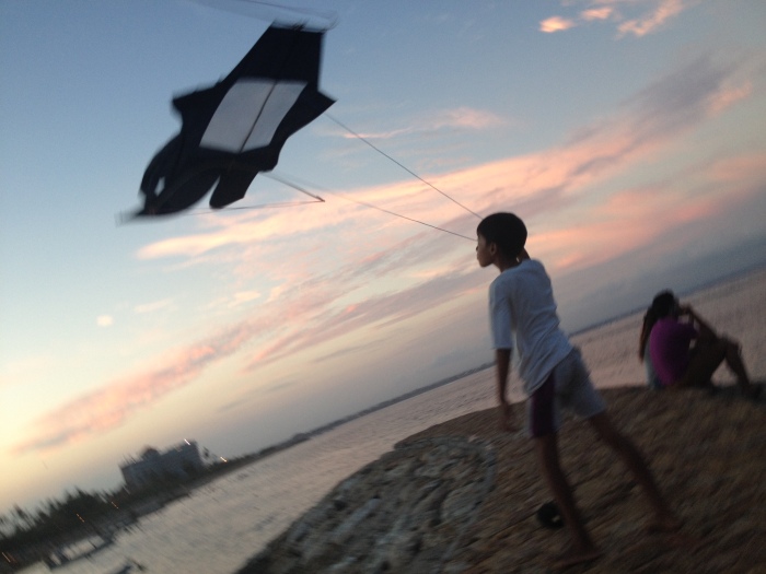 Boy with Kite at beach in Sanur, Bali.